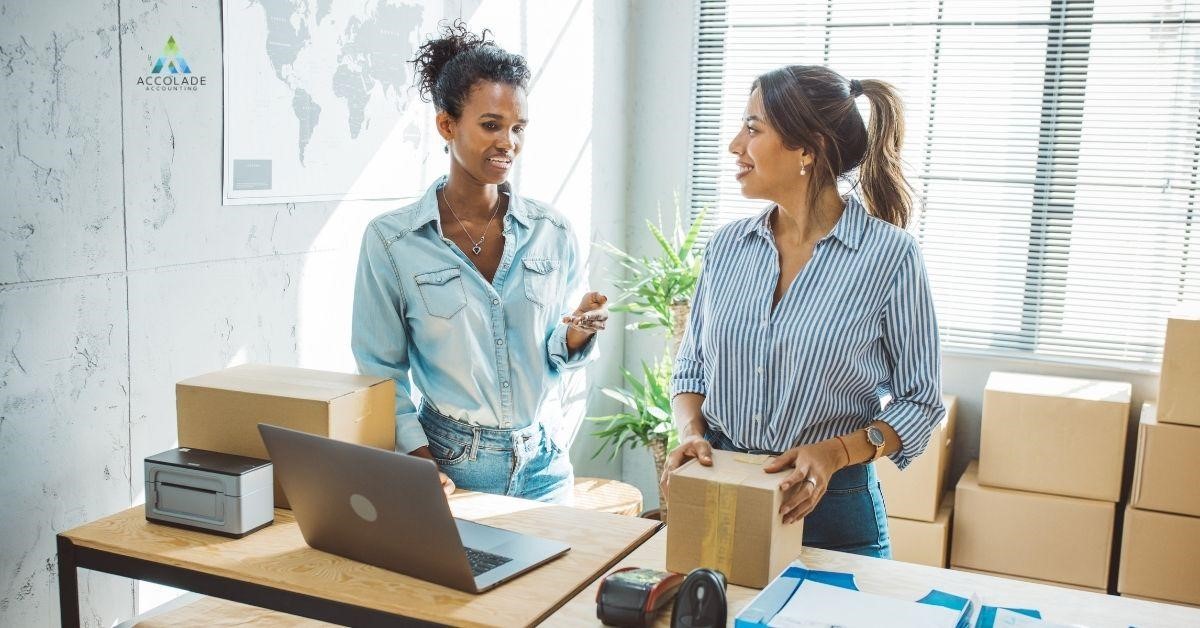 Two women are discussing a small business tax accountant.