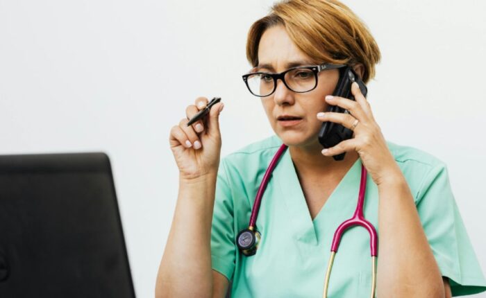Nurse sitting in front of computer