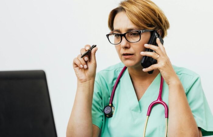 Nurse sitting in front of computer