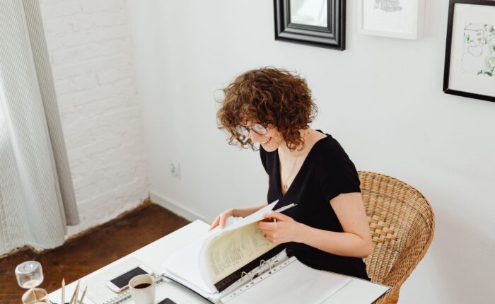 Real estate investor reviewing year-end tax planning documents at a desk