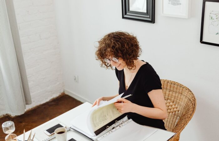 Real estate investor reviewing year-end tax planning documents at a desk